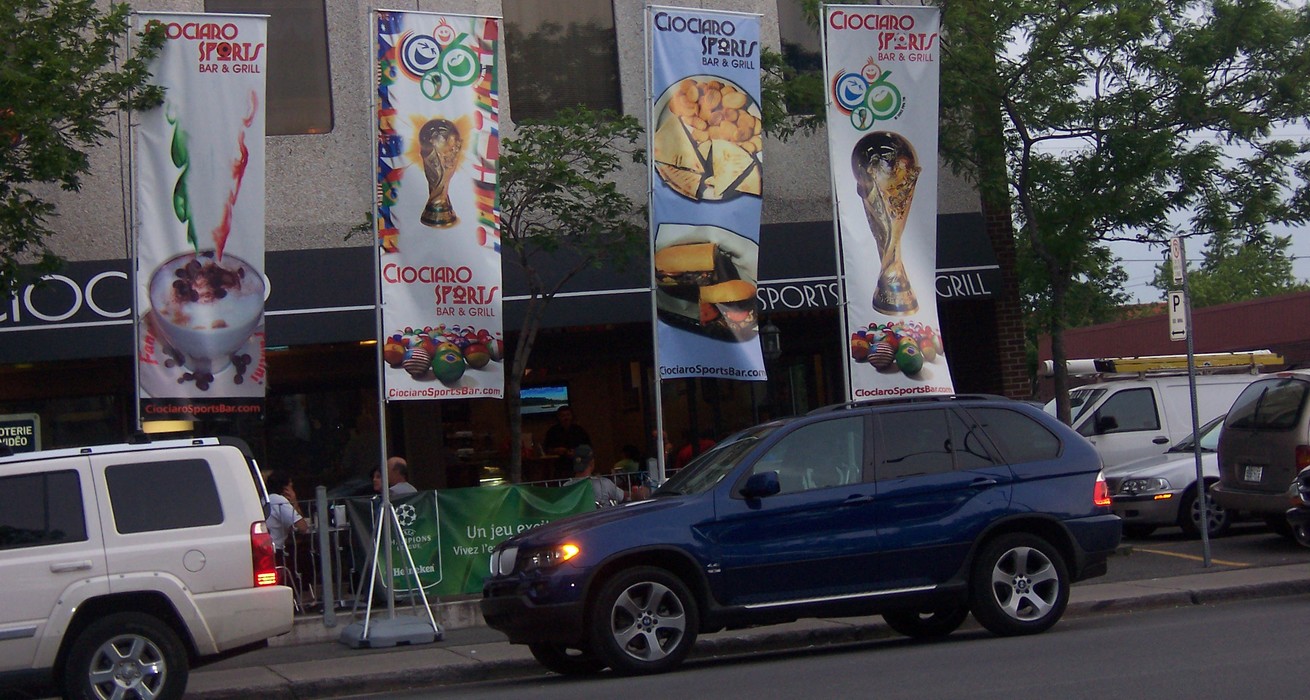 giant flagpoles installed in front a restaurant bar